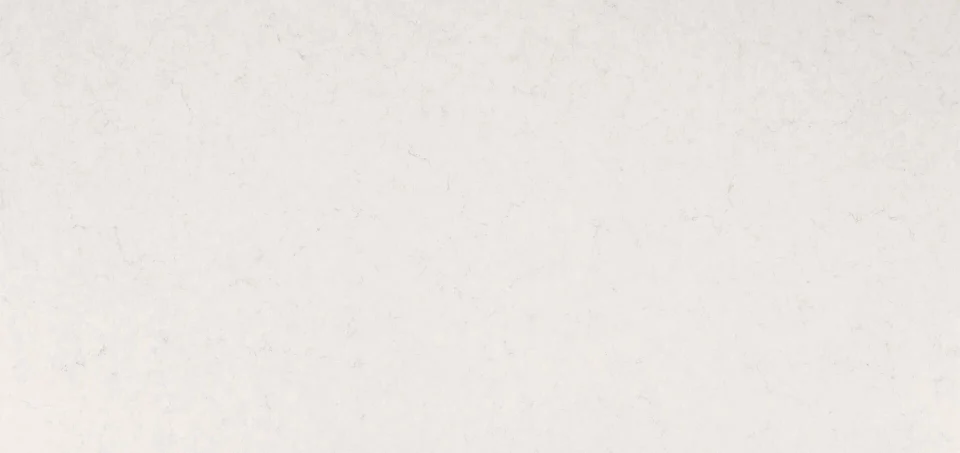 Frosty Carrina ivory-white slab with restrained pale gray veins